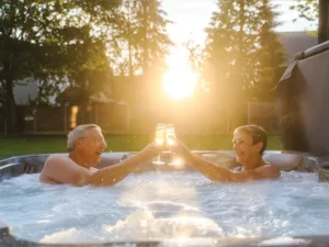 Couple sat in Aquasolus Vacation holiday let hot tub