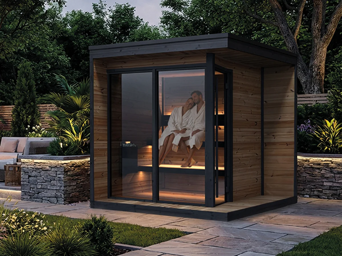 Yakia outdoor cabin sauna with couple sitting inside